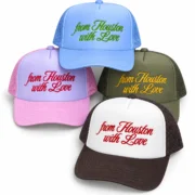 Four embroidered foam trucker hats in blue, pink, olive, white and brown color combinations