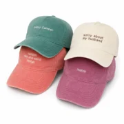 Personalized embroidered 5 panel baseball hats in green, cream, coral and purple