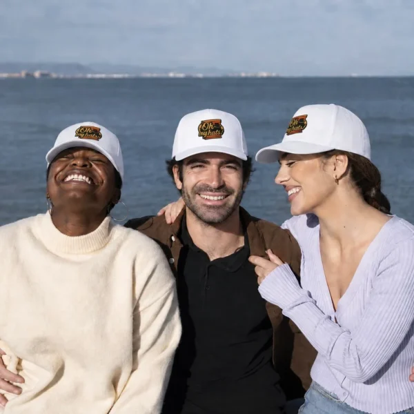 Three friends wearing matching white custom 5 panel embroidered baseball hats