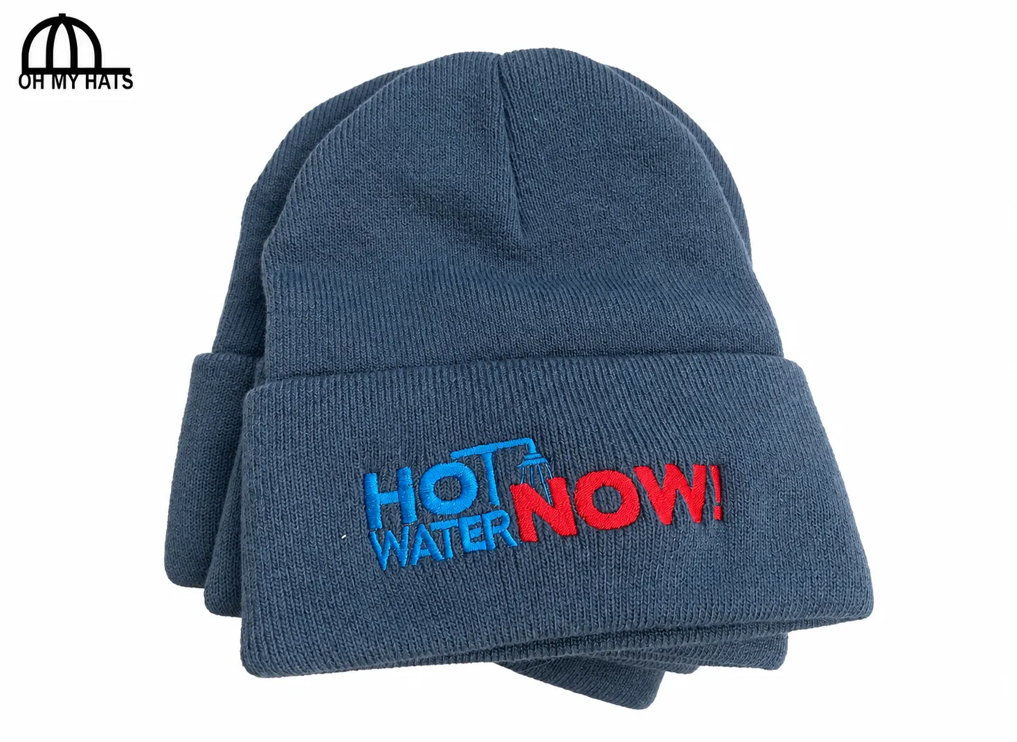 Blue-gray cuffed knit beanies with blue and red HOT WATER NOW! embroidery on a white background.