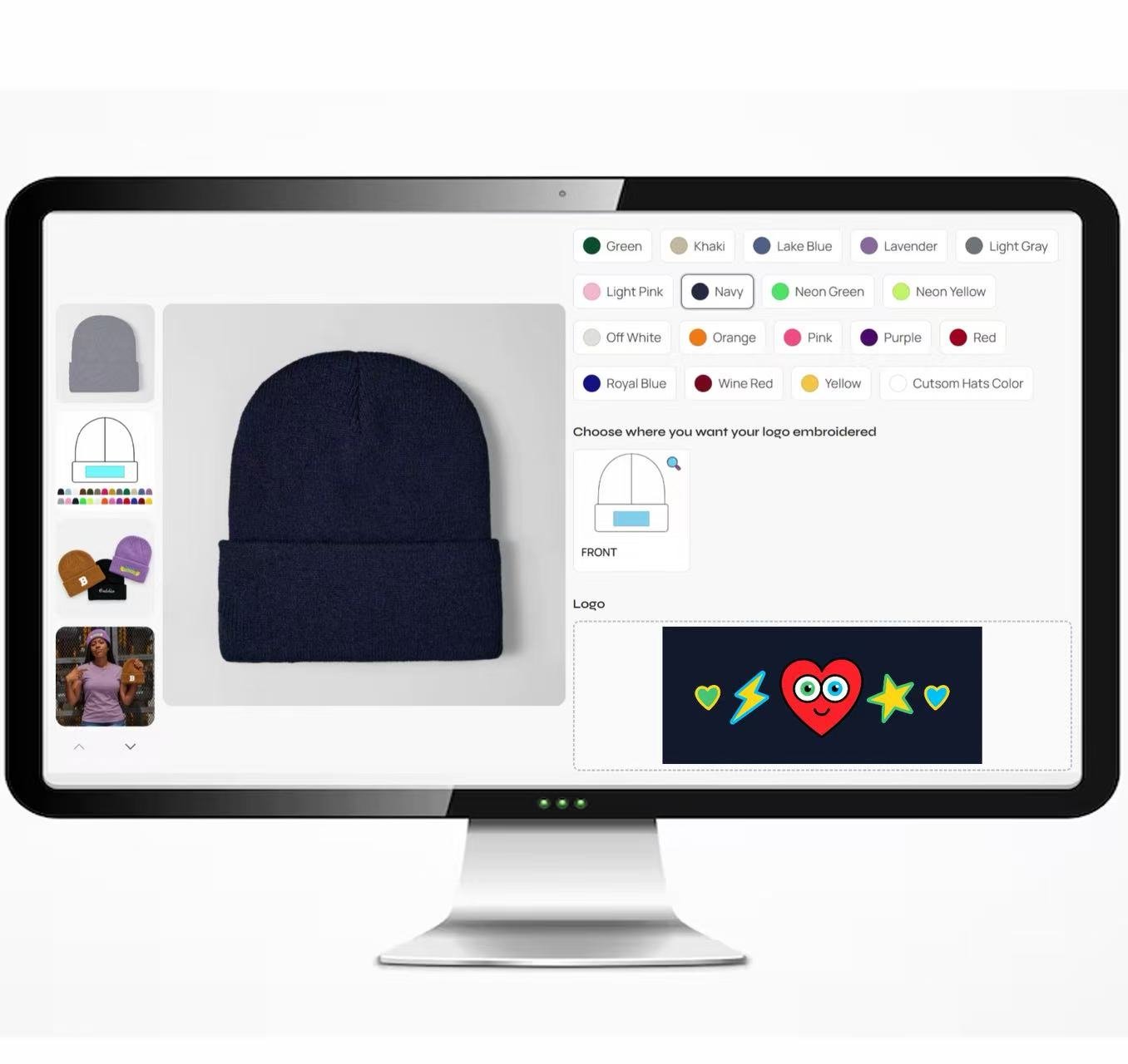 Monitor showing a navy beanie customizer with color choices, front cuff embroidery placement, and colorful heart artwork.