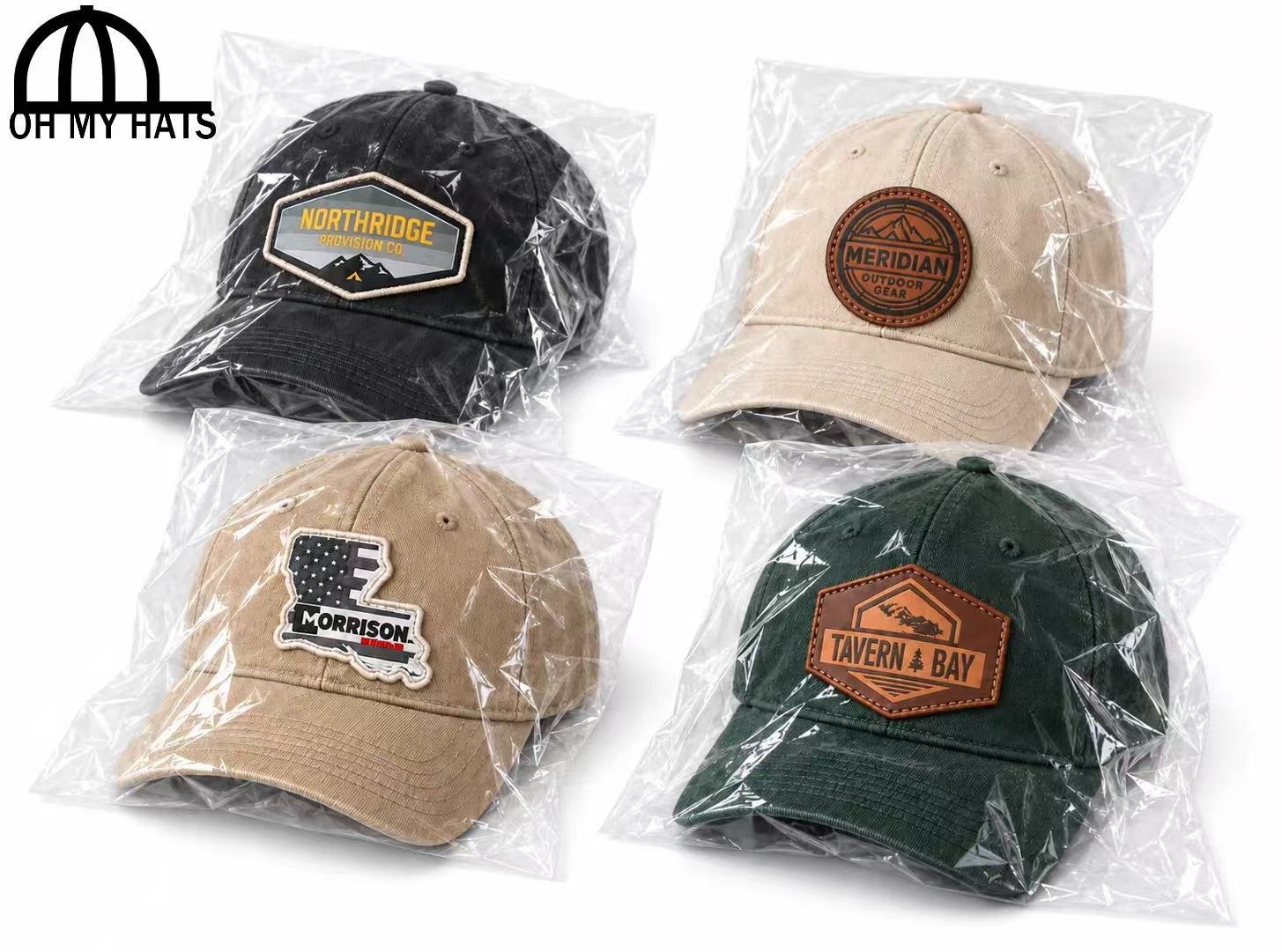 Four custom patch baseball hats individually packed in clear plastic bags on a white background.